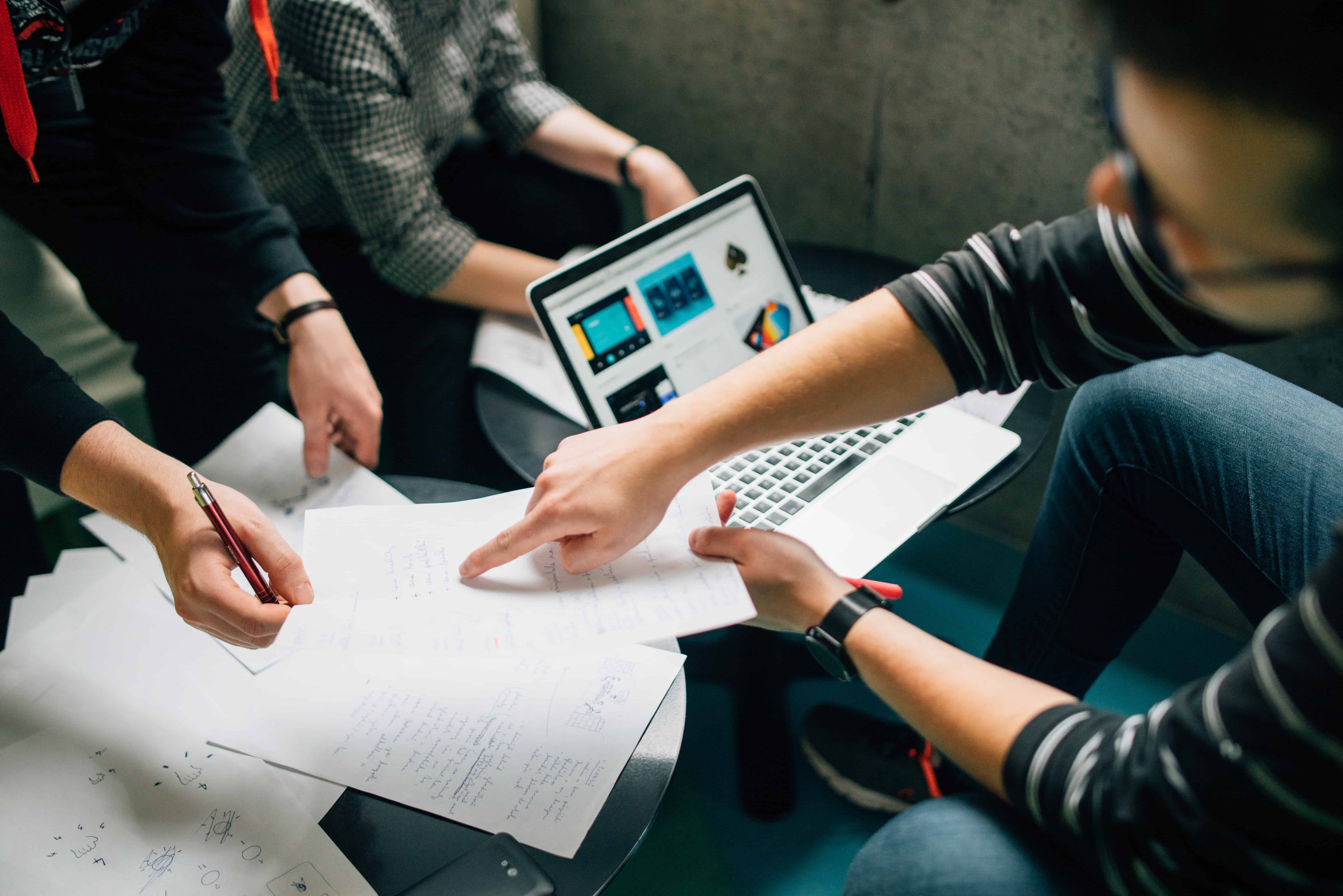 3 people in a meeting, being busy or productive?